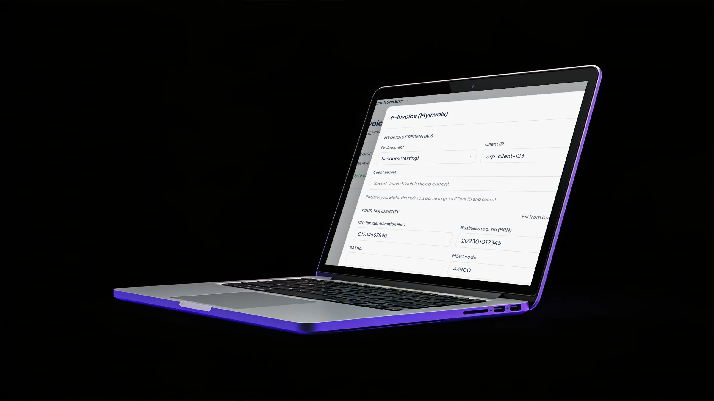 A laptop on black showing the Orbit Finance e-Invoice (MyInvois) setup with the LHDN environment, client ID and your tax identity