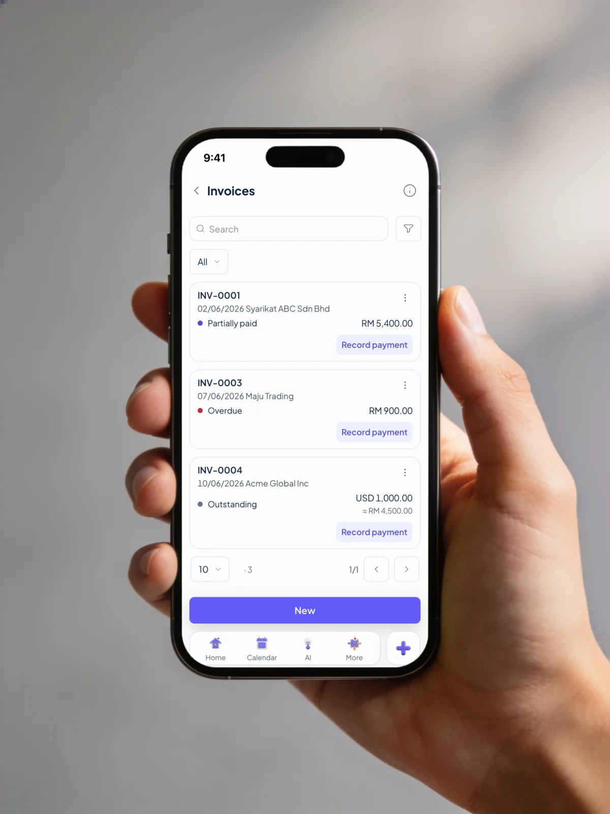 A hand holding a phone showing the Orbit Finance invoice list: INV-0001 partially paid, INV-0003 overdue and INV-0004 outstanding, each with Record payment